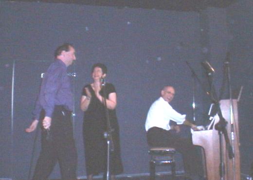 MPs Norman Baker & Jackie Ballard sing as Chris Berry plays the piano