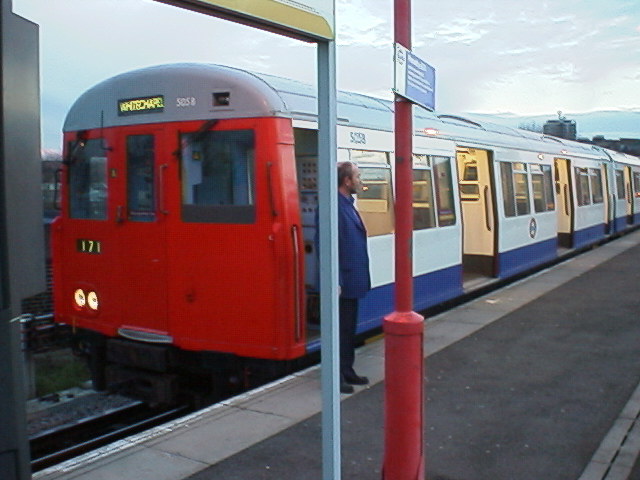 A stock train about to depart from New Cross